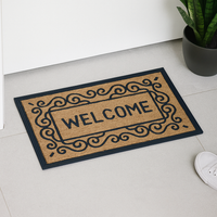 Natural coir doormat with decorative rubber border and bold "Welcome" text at the center

